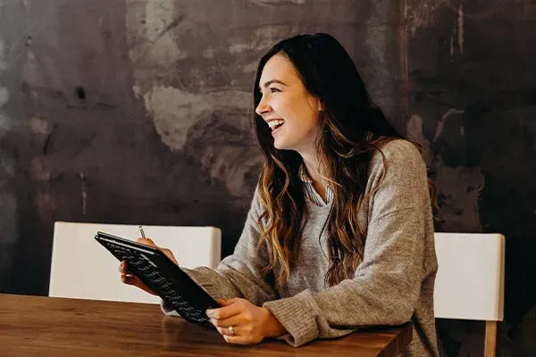 Woman using a tablet in a meeting