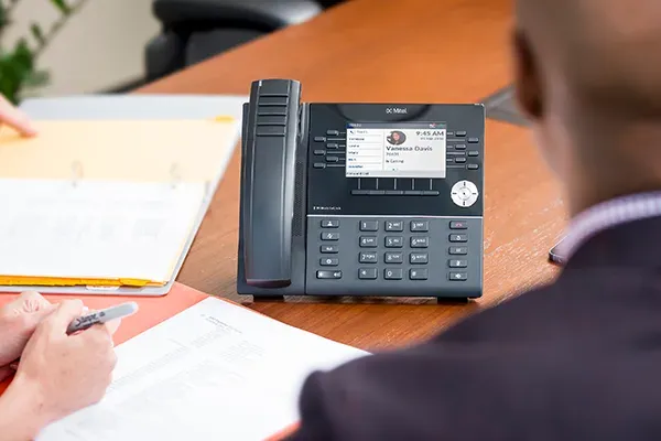 Man looking at telephone