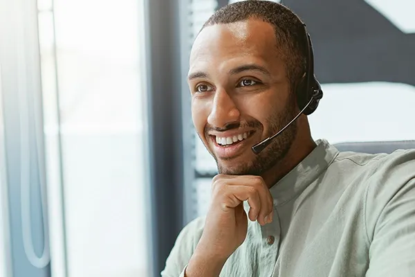 Man smiling with a headset on
