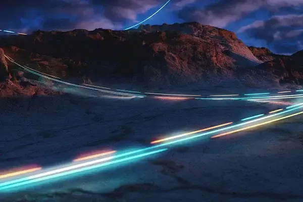 Line of connected light going through a mountain range
