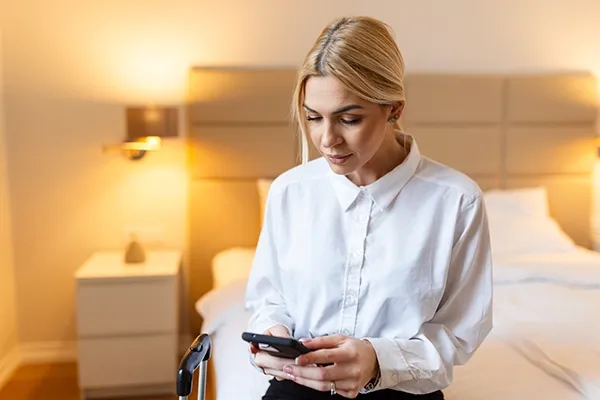 Woman using hotel wifi