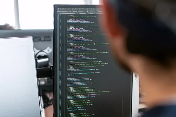 Man coding on computer