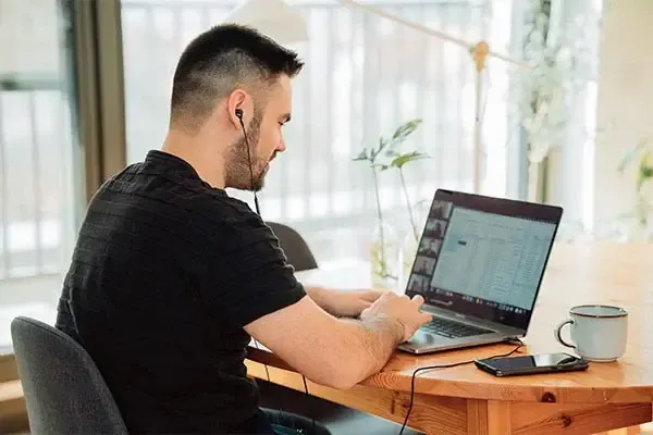 Man making a phone call using the Horizon Phone system from home