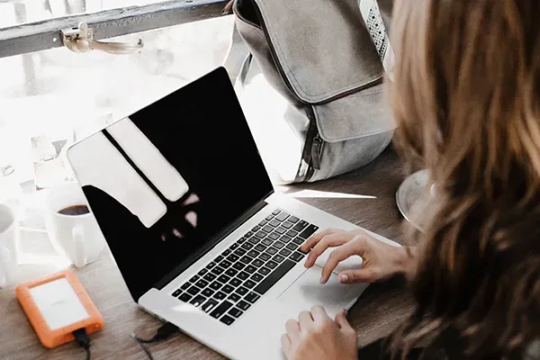 Woman typing on laptop