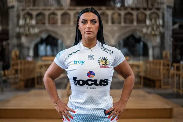 Woman standing strong with Exeter Chiefs t-shirt on