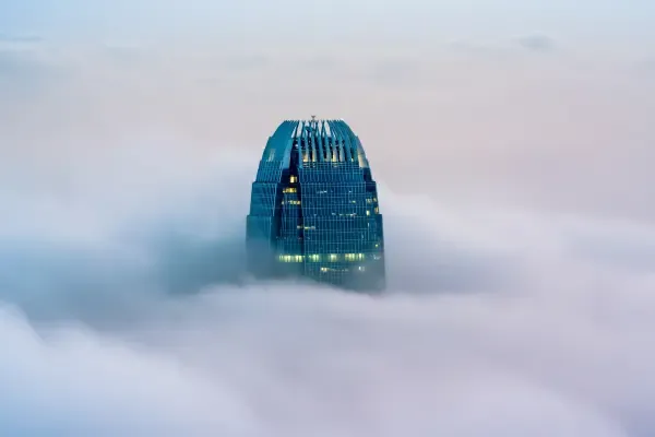 Glass skyscraper above the clouds