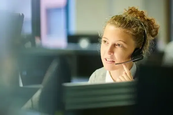 Woman making a VoIP call using the Horizon phone system