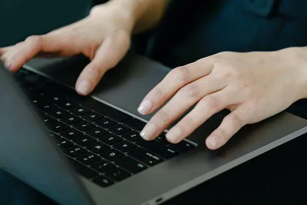 Close up of person typing