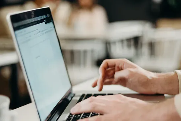 Man typing on laptop