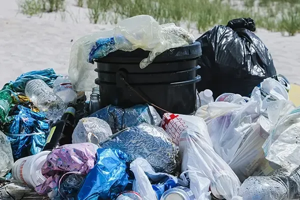 Pile of rubbish laying on beach