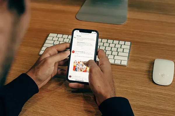 Man looking at emails on phone