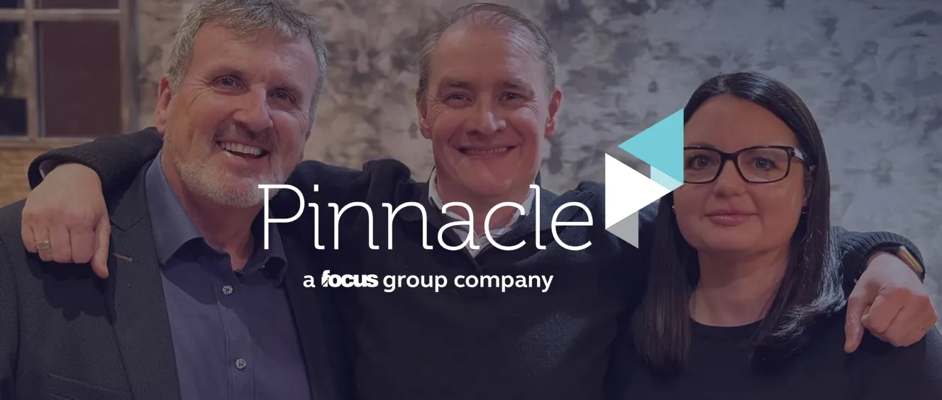 Two men and a woman smiling at the camera with the Pinnacle logo overlaid