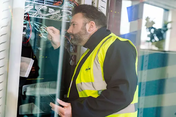 Focus Group Engineer In a Comms Cabinet
