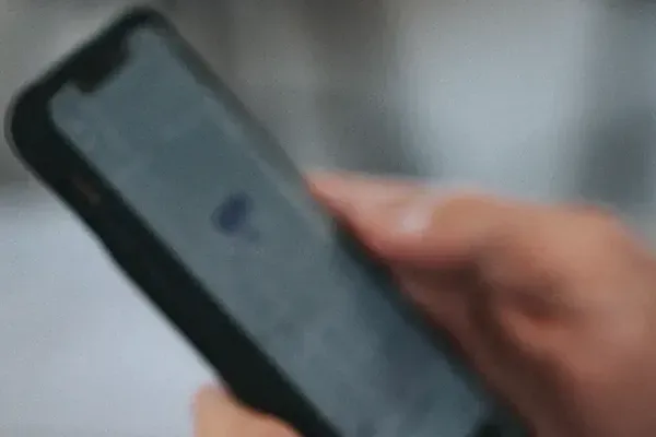 Close up of person holding phone