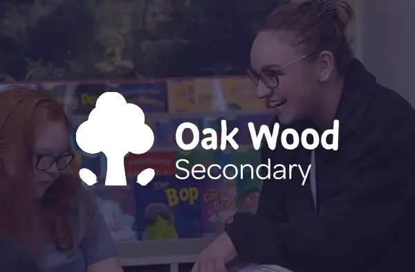 Oak Wood Secondary logo over an image of a teacher helping a student