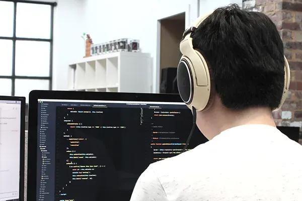 Man coding on computer