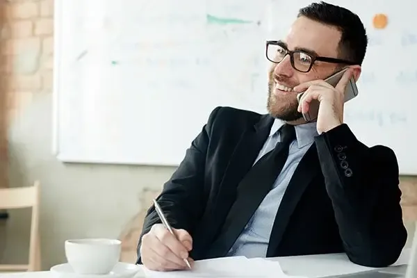 Man making a call using Gamma Horizon VoIP phone system