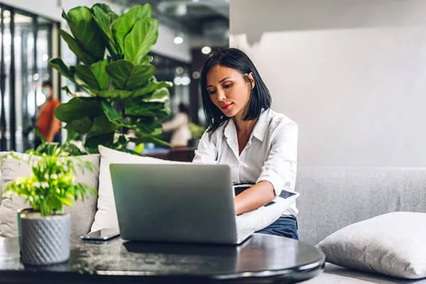Business woman using fast internet on a laptop