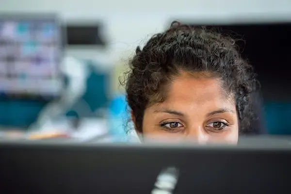 Close up of woman looking at computer monitor