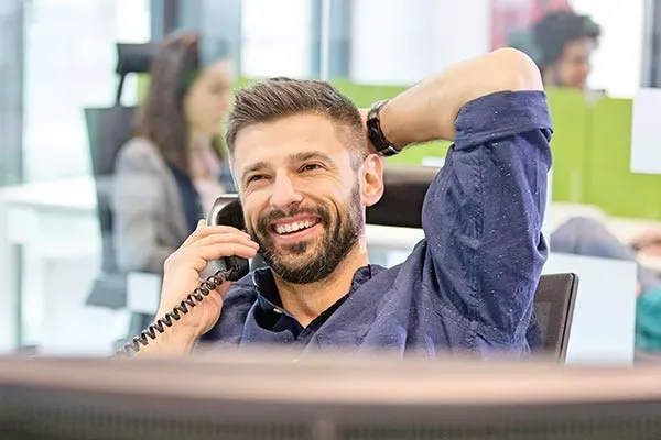 Man using a business telephone in the office