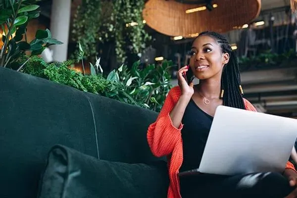 Business woman making a mobile phone call in a restaurant