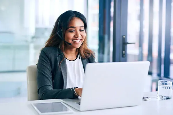 Woman in the office making a recorded call on a laptop