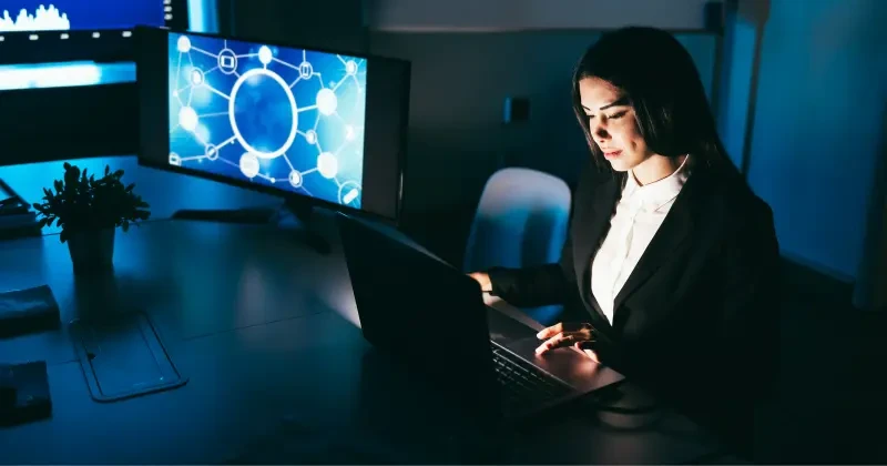 Woman using a laptop in an office